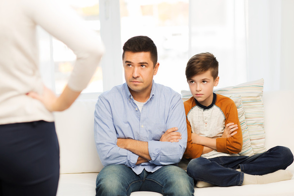 upset or displeased father, son and mother at home - Foto, Imagem
