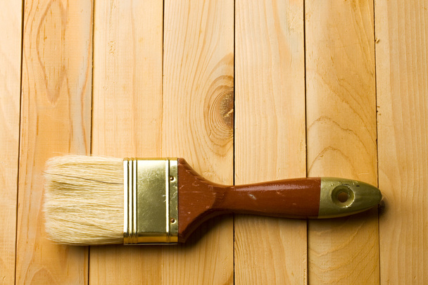 Brush isolated on wooden background - Foto, Imagen