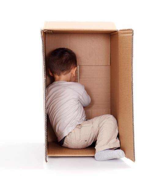 Little boy hiding in cardboard box - Zdjęcie, obraz