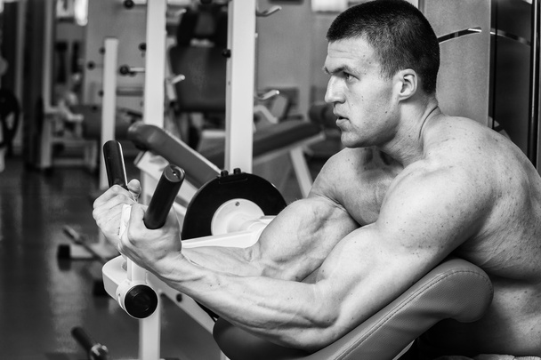 Strength training professional athlete in the gym - Photo, Image
