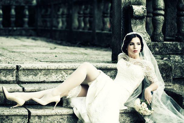 Bride sitting on stairs - Zdjęcie, obraz