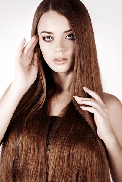 A beautiful young girl with a long hair - Φωτογραφία, εικόνα