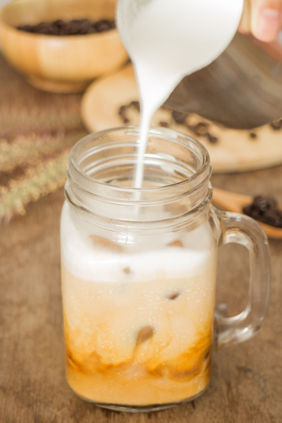 Milk pouring for fresh iced coffee - Photo, Image