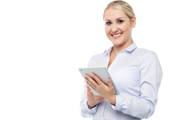 Smiling female executive working on tablet - Zdjęcie, obraz