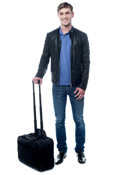 cool guy posing with trolley bag - Foto, imagen