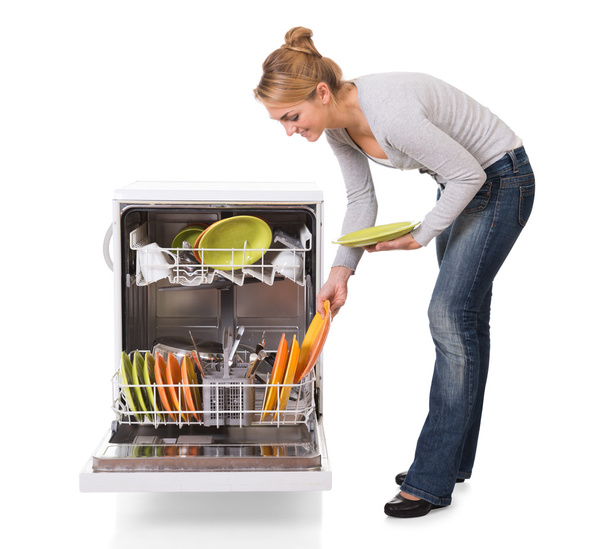 Woman Arranging Utensils In Dishwasher - Фото, изображение