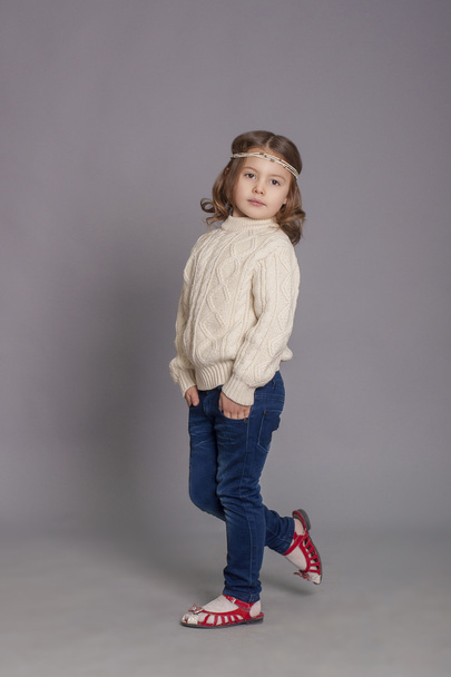 Little girl in white sweater and  jeans - Foto, Bild