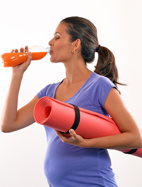 Pregnant woman drinking orange juice - Foto, immagini