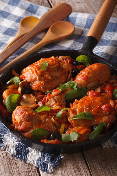Italian cuisine: Chicken Cacciatori close up in a pan. vertical - Fotó, kép