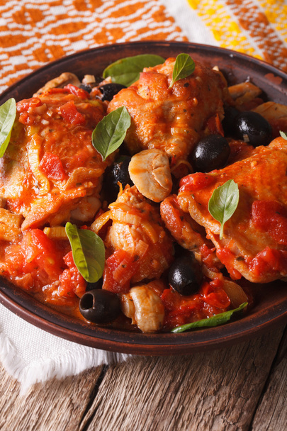 Italian cuisine: Cacciatori chicken with mushrooms closeup. Vert - Photo, Image