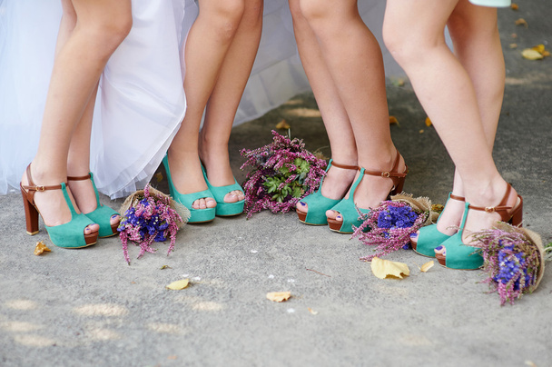 beautiful turquoise shoes of the bride and bridesmaids and wedding bouquets - Photo, Image