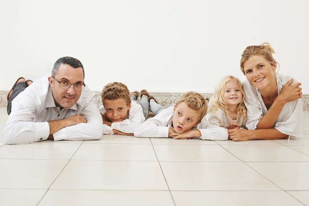 Happy large family lying on floor - Foto, Imagem