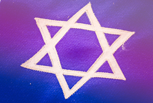 Αστέρι του David σχετικά με μπλε σημαία σημαία - Φωτογραφία, εικόνα