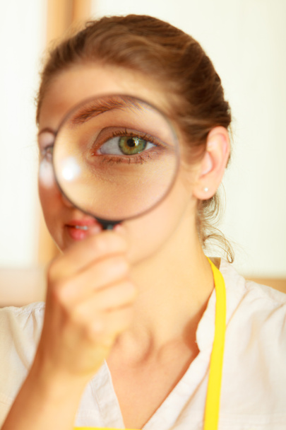 Woman looking through magnifying glass. - Fotó, kép