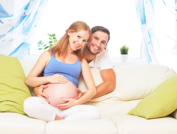 happy family in anticipation of birth of baby. Pregnant woman an - Foto, imagen