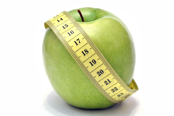 πράσινο μήλο και μετροταινία - Φωτογραφία, εικόνα