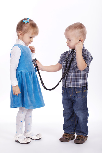 little girl and boy playing with stethoscope - Fotografie, Obrázek