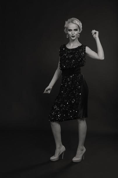 Beautiful blonde in vintage dress on a dark background - Photo, Image