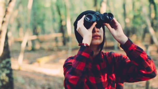 girl with binoculars in the forest - Footage, Video