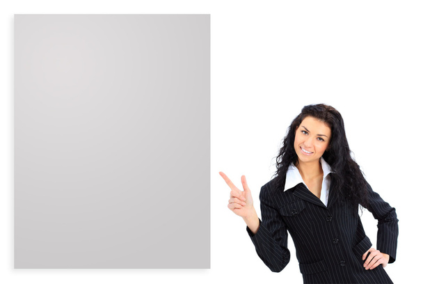 Happy smiling young business woman showing blank signboard, isolated on white background - Foto, imagen