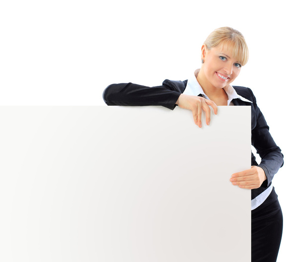 Happy smiling young business woman showing blank signboard, isolated on white background - Foto, imagen