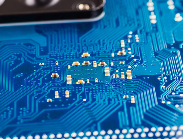 blue circuit board background of computer motherboard close up - 写真・画像