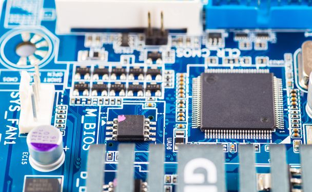 Printed computer motherboard with microcircuit, close up - Photo, Image