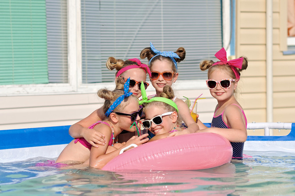 Portrait of children on the pool in summer - Photo, Image