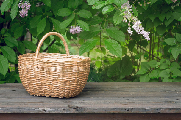 wicker basket on old wooden table - Photo, Image