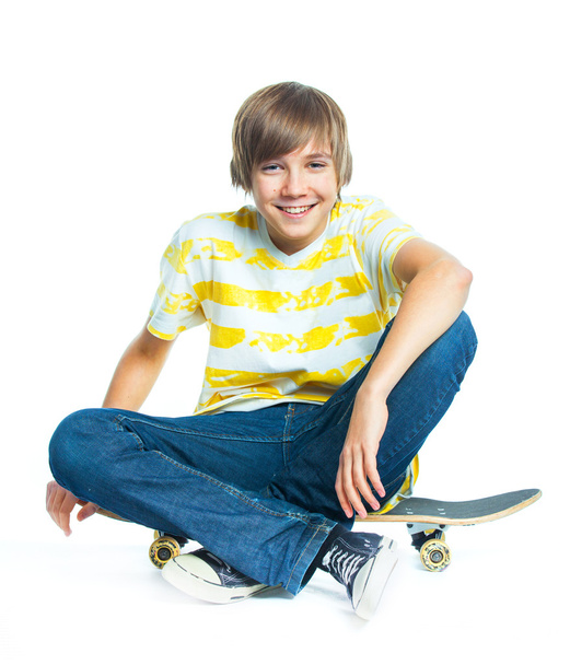Blond boy on sitting on skateboard - Zdjęcie, obraz