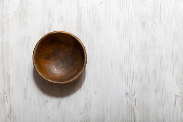 wooden bowl on white table - Valokuva, kuva