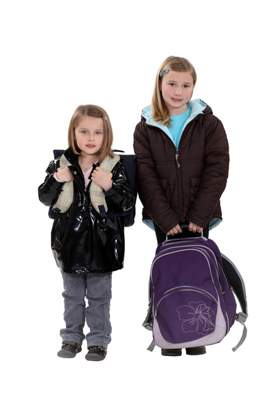 Two girls with schoolbags - Фото, изображение