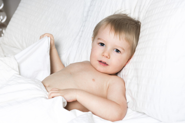 Healthy Lifestyle of young little children boy on bed - Fotografie, Obrázek