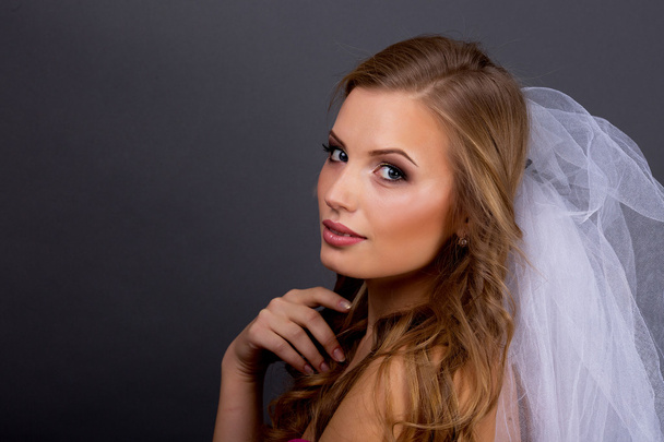 Portrait of beautiful female model on blue background - Foto, afbeelding