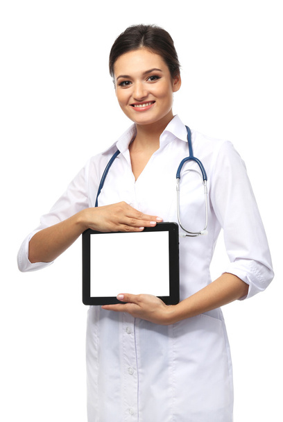 Smiling medical doctor holding a tablet - Fotoğraf, Görsel