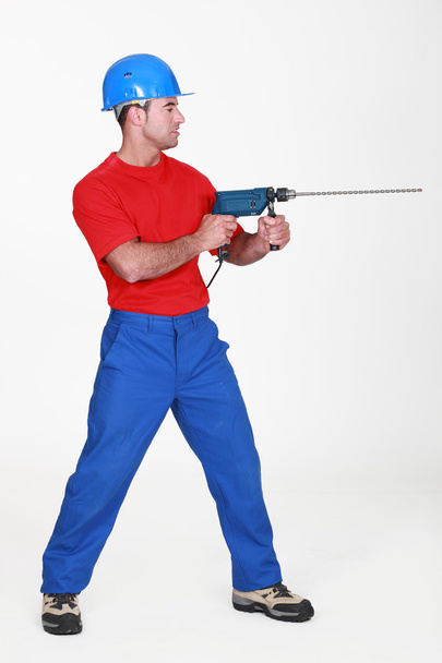 Man using large drill - Фото, изображение