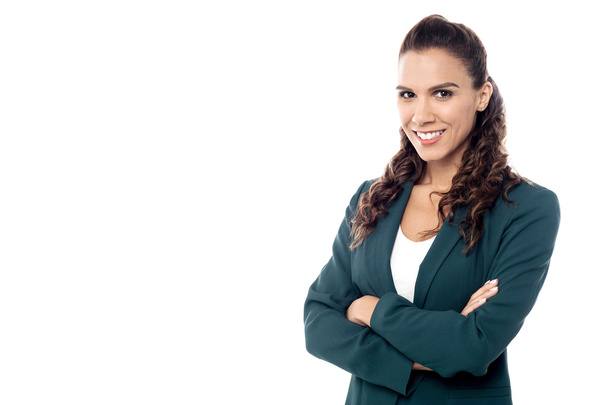 Confident businesswoman with arms crossed - Photo, image
