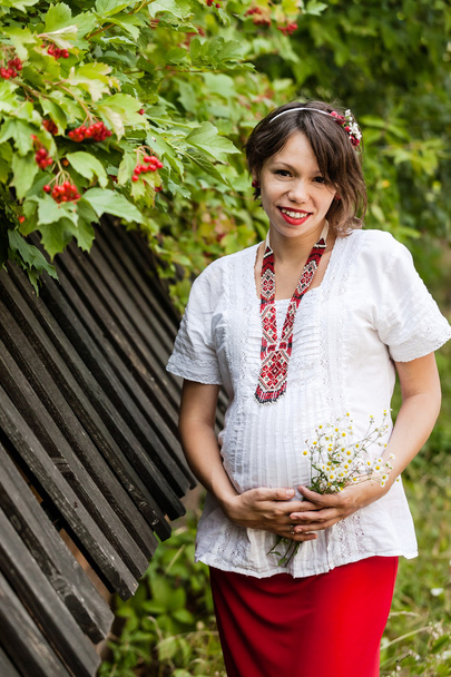 Ukrainian pregnant woman in traditional embroidered shirt - Photo, image