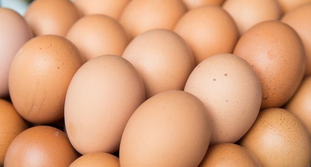 fresh eggs on tray at market - Photo, image