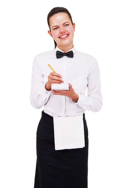 Молода жінка в уніформі офіціанта порядок письма над білим фоном
 - Фото, зображення