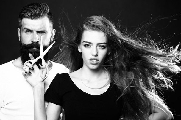 Fashionable couple with scissors - Zdjęcie, obraz