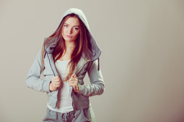 Pensive teenage girl in hooded sweatshirt. Fashion - Foto, afbeelding