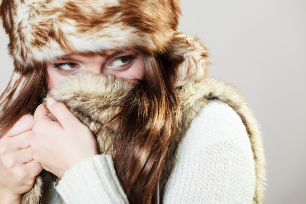 woman in fur cap posing - Фото, изображение