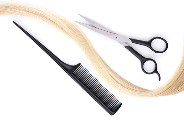 Shiny blond hair with hair cutting shears and comb isolated on white - Valokuva, kuva