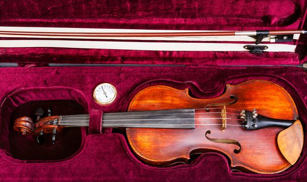 top view of old violin with bow in red velvet case - Photo, Image