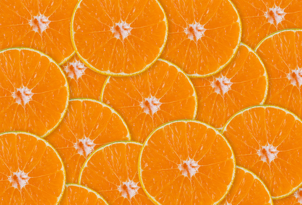 abstrakter Hintergrund mit Zitrusfrüchten aus Nahaufnahme Orangenscheiben - Foto, Bild