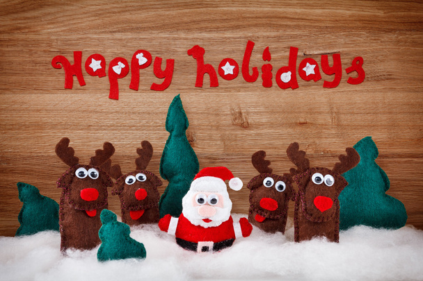 Kerstmis herten en Santa Claus zacht speelgoed gemaakt van vilt.  - Foto, afbeelding