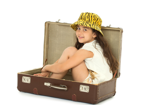 The girl sitting in suitcase - Photo, Image