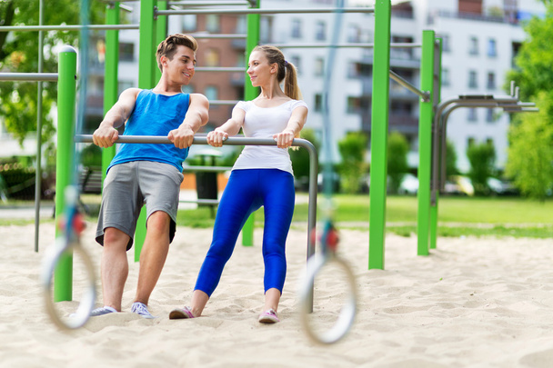 Young couple training outdoors - Photo, Image
