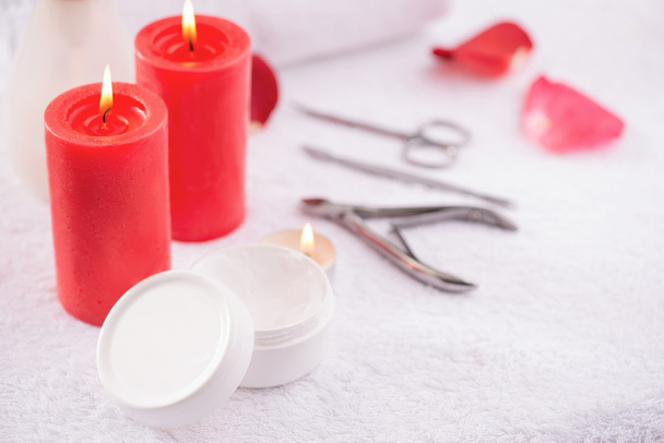 Red candles burning on the table - 写真・画像